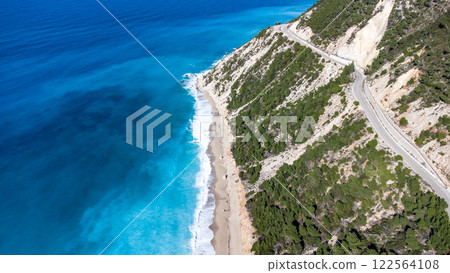 Tsoukalades beach. Aerial view with road. Pristine waters. Lefkada. Greece Tsoukalades beach. Aerial view with road. Pristine waters. Lefkada. Greece 122564108