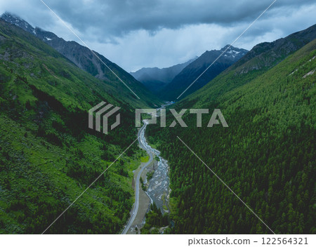Aerial view of beautiful grassland and forest mountain landscape Aerial view of beautiful grassland and forest mountain landscape 122564321