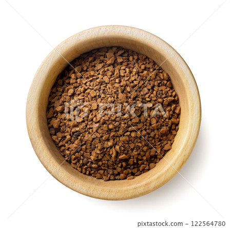 Instant coffee in a wooden plate close-up on a white. Top view. 122564780