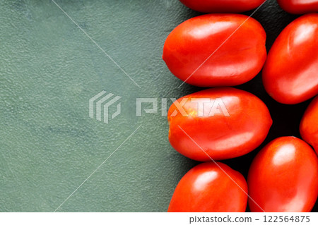Homegrown Red Tomatoes on Textured Green Surface for Sustainable Farm-to-Table Meals, Top View, Copy Space Homegrown Red Tomatoes on Textured Green Surface for Sustainable Farm-to-Table Meals, Top View, Copy Space 122564875
