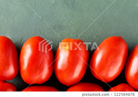 Homegrown Red Tomatoes on Textured Green Surface for Sustainable Farm-to-Table Meals, Top View, Copy Space 122564876