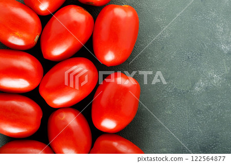 Homegrown Red Tomatoes on Textured Green Surface for Sustainable Farm-to-Table Meals, Top View, Copy Space Homegrown Red Tomatoes on Textured Green Surface for Sustainable Farm-to-Table Meals, Top View, Copy Space 122564877