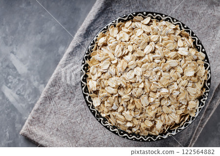 Raw Rolled Oats on Gray Background, Healthy Eating Concept, Copy Space, Top View Raw Rolled Oats on Gray Background, Healthy Eating Concept, Copy Space, Top View 122564882