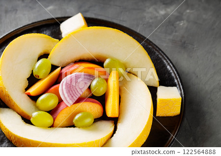 Fresh Fruits and Vegetables on Black Plate, Vegetarian Food Concept, Close-Up 122564888