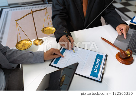 Business people and lawyers discussing contract papers sitting in the table at office in the morning. concepts of law, advice, legal services. 122565330