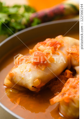 Close-up of stuffed cabbage rolls in tomato sauce. Close-up of stuffed cabbage rolls in tomato sauce. 122566144