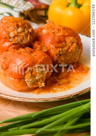 Stuffed Peppers with Meat and Rice in Tomato Sauce 122566148