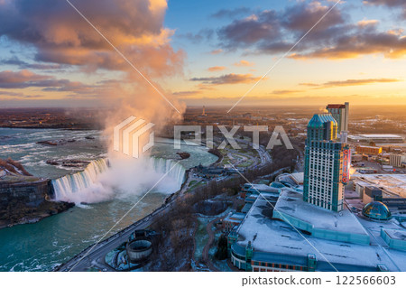 Aerial view of Niagara Falls City downtown horizon and Horseshoe Falls in a winter sunny day sunset time. 122566603