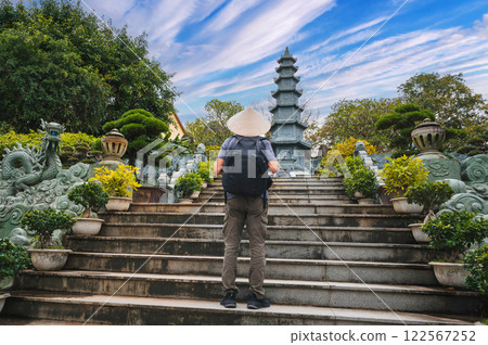 back of a male tourist traveler at Linh Ung Pagoda in Da Nang in Vietnam. Concept of travel and tourism in Asia 122567252