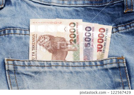 Tanzanian shilling in the pocket of blue jeans Tanzanian shilling in the pocket of blue jeans 122567429
