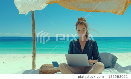 A woman doing nomadic work on a resort beach 122568031