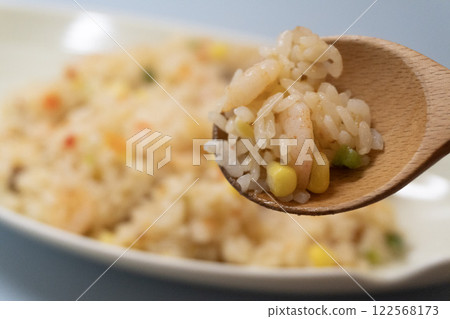 Pilaf being brought to the mouth 122568173