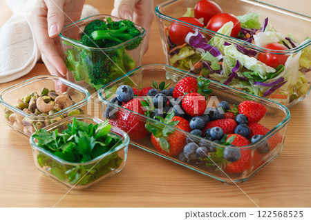 Healthy vegan food preparations for week in glass containers. Vegetables, nuts, berries in boxes. Healthy vegan food preparations for week in glass containers. Vegetables, nuts, berries in boxes. 122568525