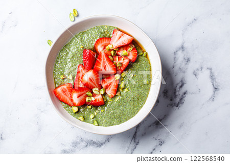 Green matcha chia pudding with strawberries and pistachios. Green matcha chia pudding with strawberries and pistachios. 122568540