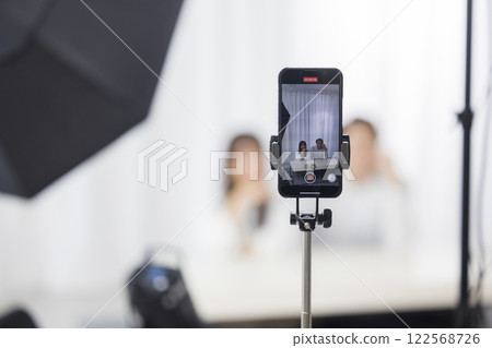 A couple looking at a smartphone 122568726