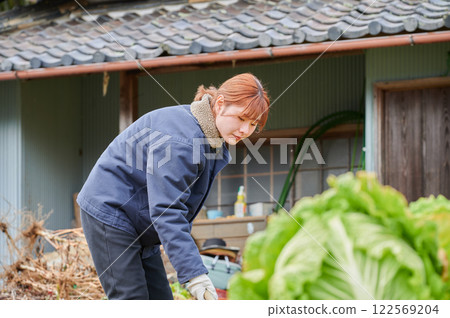 Woman working in the fields, country life, home garden Woman working in the fields, country life, home garden 122569204
