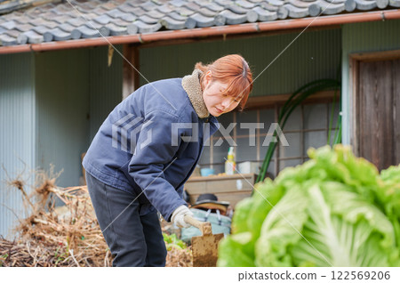 Woman working in the fields, country life, home garden Woman working in the fields, country life, home garden 122569206