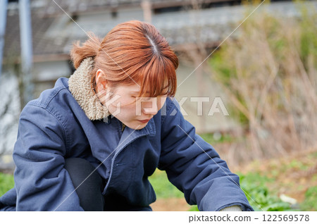 Woman working in the fields, country life, home garden Woman working in the fields, country life, home garden 122569578