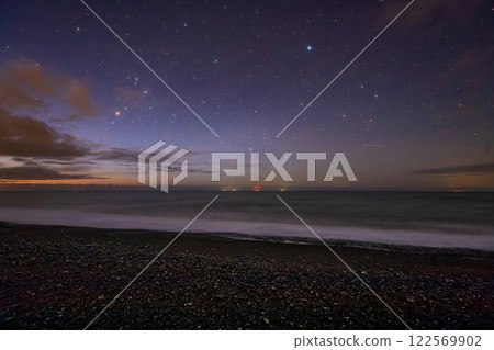 Coast and starry sky at dawn 122569902