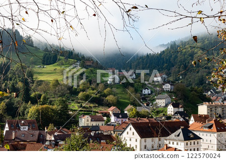 Idrija stunning bucolic view in the autumn. Green hill and old houses. Slovenia Idrija stunning bucolic view in the autumn. Green hill and old houses. Slovenia 122570024