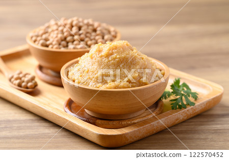 Miso paste in wooden bowl, Japanese seasoning made from fermenting soybeans with salt 122570452