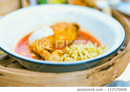 Northern Thai noodle curry soup with chicken Northern Thai noodle curry soup with chicken 122570696