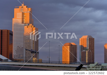 Skyscrapers in the setting sun 122572602