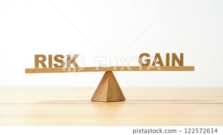 Wooden Seesaw Illustrating Risk and Gain Concept 122572614