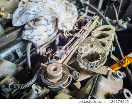 old inline 4 cylinder combustion gasoline engine with dismounted air intake old inline 4 cylinder combustion gasoline engine with dismounted air intake 122574295