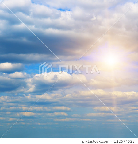 Blue sky with clouds and bright sun. Blue sky with clouds and bright sun. 122574523