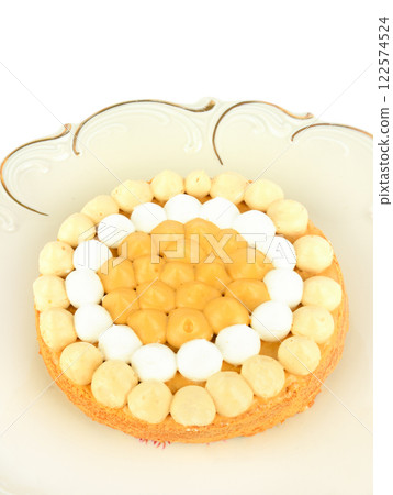 Birthday cake on a vintage porcelain dish isolated on a white. Birthday cake on a vintage porcelain dish isolated on a white. 122574524