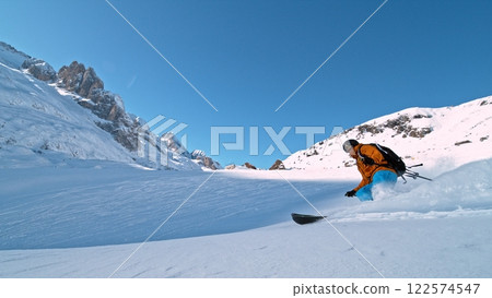 Freeze Motion of Skier Running Down. Powder Snow Exploding. Freeze Motion of Skier Running Down. Powder Snow Exploding. 122574547