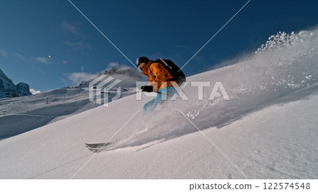 Freeze Motion of Skier Running Down. Powder Snow Exploding. Freeze Motion of Skier Running Down. Powder Snow Exploding. 122574548