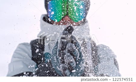 Freeze Motion of Skier Clapping Hand. Powder Snow Exploding. Freeze Motion of Skier Clapping Hand. Powder Snow Exploding. 122574551
