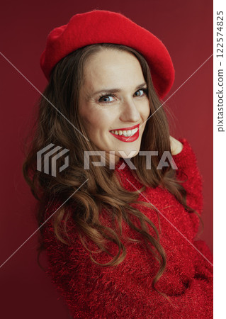 smiling trendy female in red sweater and beret smiling trendy female in red sweater and beret 122574825