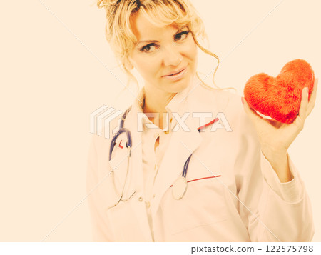 Female cardiologist with red heart. Female cardiologist with red heart. 122575798