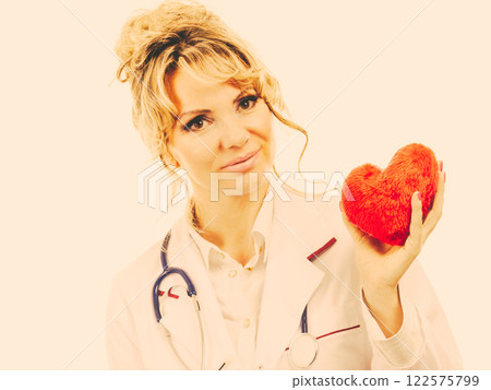 Female cardiologist with red heart. Female cardiologist with red heart. 122575799