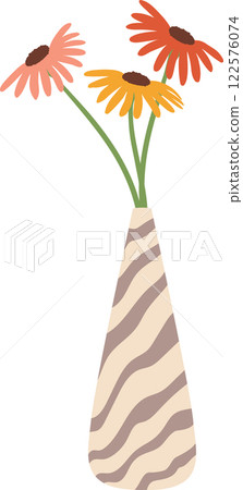 Vibrant gerbera flowers with colorful petals arranged in a decorative striped vase, enhancing the cheerful and elegant atmosphere of home decor and interior design 122576074