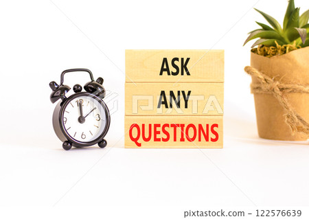 Ask any questions symbol. Concept words Ask any questions on beautiful wooden blocks. Beautiful white background. Black alarm clock. Business ask any questions concept. Copy space. 122576639