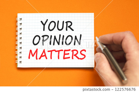 Your opinion matters symbol. Concept words Your opinion matters on beautiful white note. Beautiful orange background. Black pen. Businessman hand. Business your opinion matters concept. Copy space. Your opinion matters symbol. Concept words Your opinion matters on beautiful white note. Beautiful orange background. Black pen. Businessman hand. Business your opinion matters concept. Copy space. 122576676