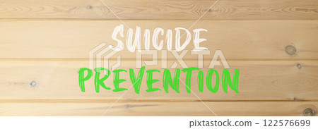 Suicide prevention symbol. Concept words Suicide prevention on beautiful wooden wall. Beautiful wooden wall background. Psychological and suicide prevention concept. Copy space. 122576699