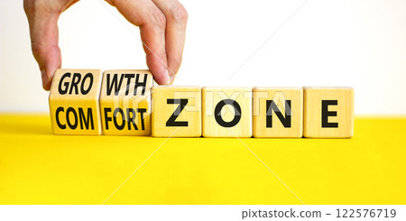 Comfort or growth zone symbol. Concept words Comfort zone Growth zone on wooden cubes. Beautiful yellow table white background. Psychologist hand. Business comfort or growth zone concept. Copy space. Comfort or growth zone symbol. Concept words Comfort zone Growth zone on wooden cubes. Beautiful yellow table white background. Psychologist hand. Business comfort or growth zone concept. Copy space. 122576719