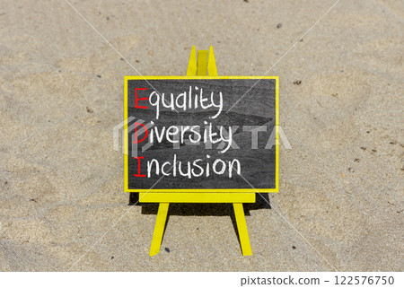 EDI equality diversity inclusion symbol. Concept words EDI equality diversity inclusion on yellow blackboard. Beautiful sand background. Business EDI equality diversity inclusion concept. Copy space. EDI equality diversity inclusion symbol. Concept words EDI equality diversity inclusion on yellow blackboard. Beautiful sand background. Business EDI equality diversity inclusion concept. Copy space. 122576750