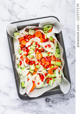 raw, chopped vegetables in a basket , ingredients for making ossobuco, top view, no people, 122577170