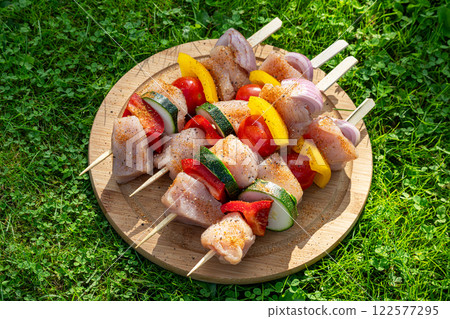 fresh raw chicken and vegetables skewers fresh raw chicken and vegetables skewers 122577295