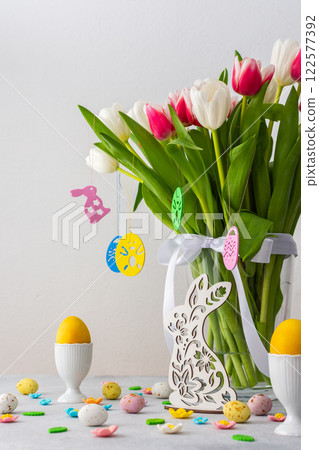 Spring bouquet of pink and white tulips and bunny looking for Easter eggs Spring bouquet of pink and white tulips and bunny looking for Easter eggs 122577392