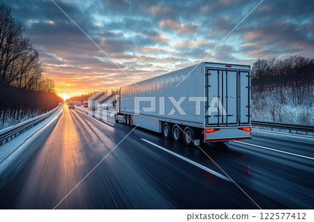 Long Haul Truck Transport at Sunset on Highway with Blurred Motion Effect 122577412