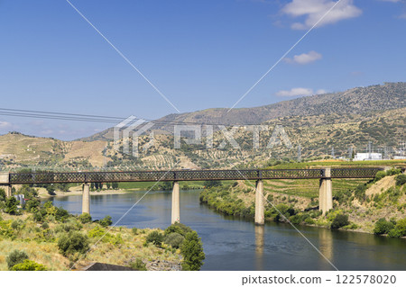 Typical Douro landscape near Pocinho, UNESCO site, Vila Nova de Foz Coa, Alto Douro wine region, Portugal Typical Douro landscape near Pocinho, UNESCO site, Vila Nova de Foz Coa, Alto Douro wine region, Portugal 122578020