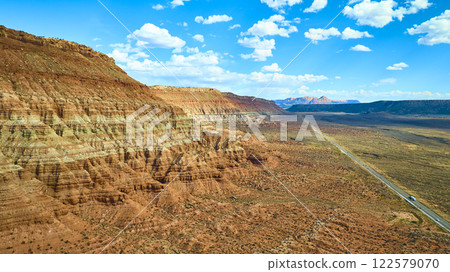 Aerial of Red Rock Formations and Desert Road in Utah Aerial of Red Rock Formations and Desert Road in Utah 122579070
