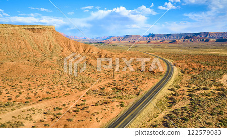 Aerial of Red Rock Desert and Winding Road in Utah 122579083